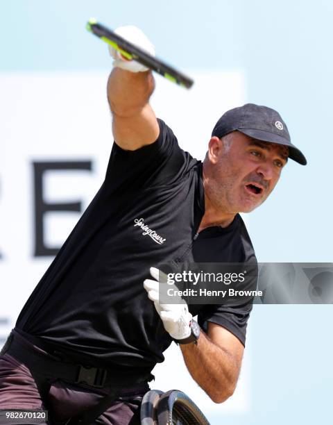 Stephane Houdet of France plays a shot during the men's wheelchair final against Stefan Olsson of Sweden during Day 7 of the Fever-Tree Championships...