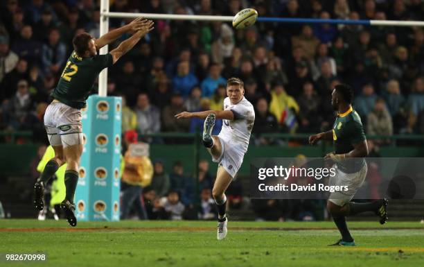 Owen Farrell of England kicks the ball upfield during the third test match between South Africa and England at Newlands Stadium on June 23, 2018 in...