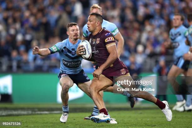 Will Chambers of the Maroons makes a break during game two of the State of Origin series between the New South Wales Blues and the Queensland Maroons...