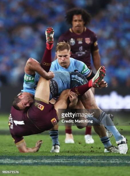 Billy Slater of the Maroons is tackled by Boyd Cordner of the Blues during game two of the State of Origin series between the New South Wales Blues...