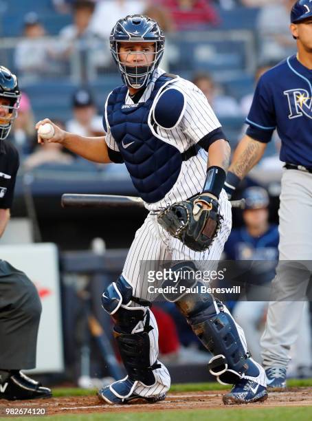 Catcher Gary Sanchez of the New York Yankees throws to first base in an MLB baseball game against the Tampa Bay Rays on June 15, 2018 at Yankee...