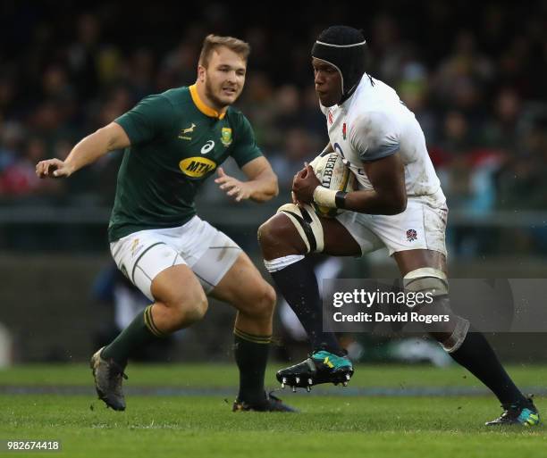 Maro Itoje of England moves away from Andre Esterhuizen during the third test match between South Africa and England at Newlands Stadium on June 23,...