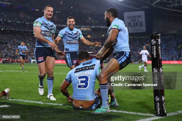 Latrell Mitchell of the Blues scores a try during game two of the State of Origin series between the New South Wales Blues and the Queensland Maroons...