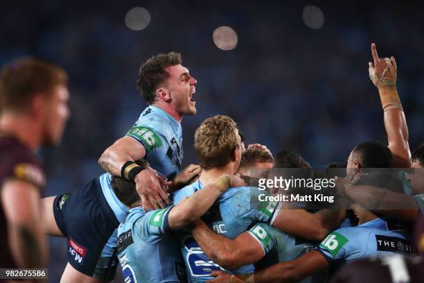 Angus Crichton of the Blues and team mates celebrates victory at the end of game two of the State of Origin series between the New South Wales Blues...