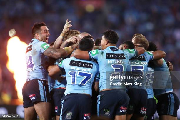 Blues players celebrate victory at the end of game two of the State of Origin series between the New South Wales Blues and the Queensland Maroons at...