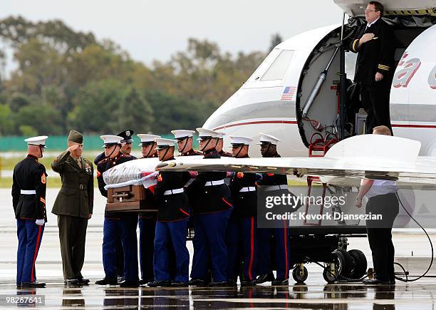 Marine honor guard carry the casket of LAPD SWAT officer and US Marine reservist Sgt. Maj. Robert J. Cottle, killed March 24 in a roadside bombing in...