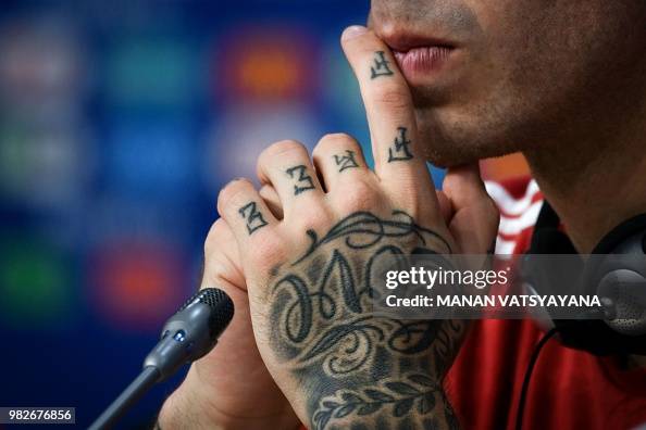 Tattoos of Russia's forward Fedor Smolov gives a press conference on... News Photo - Getty Images Tattoos of Russia's forward Fedor Smolov gives a press conference on... News Photo - Getty Images