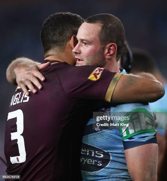 Maroons captain Greg Inglis and Blues captain Boyd Cordner embrace after game two of the State of Origin series between the New South Wales Blues and...