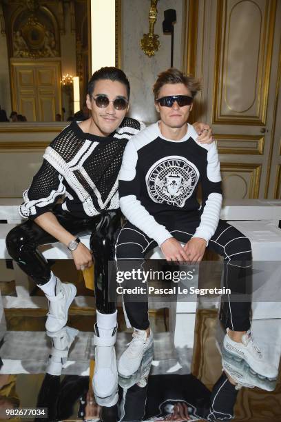 Hu Bing and Oliver Cheshire attend the Balmain Menswear Spring/Summer 2019 show as part of Paris Fashion Week on June 24, 2018 in Paris, France.