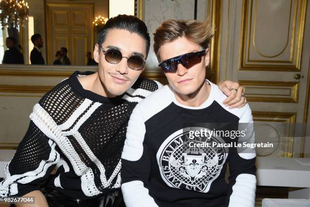 Hu Bing and Oliver Cheshire attend the Balmain Menswear Spring/Summer 2019 show as part of Paris Fashion Week on June 24, 2018 in Paris, France.