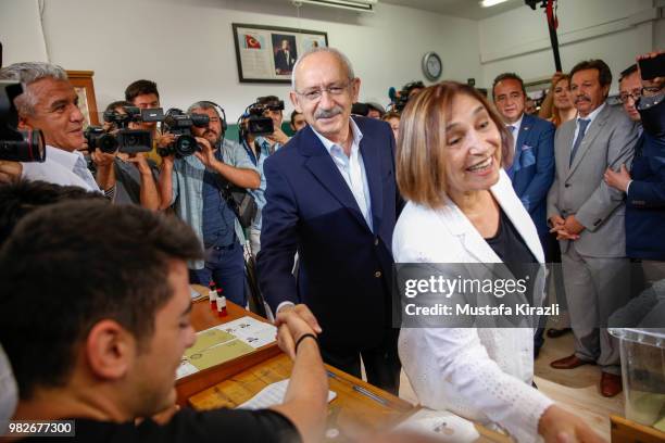 Turkey's main opposition Republican People's Party Kemal Kilicdaroglu and his wife Selvi Kilicdaroglu casts their ballot at a polling station during...