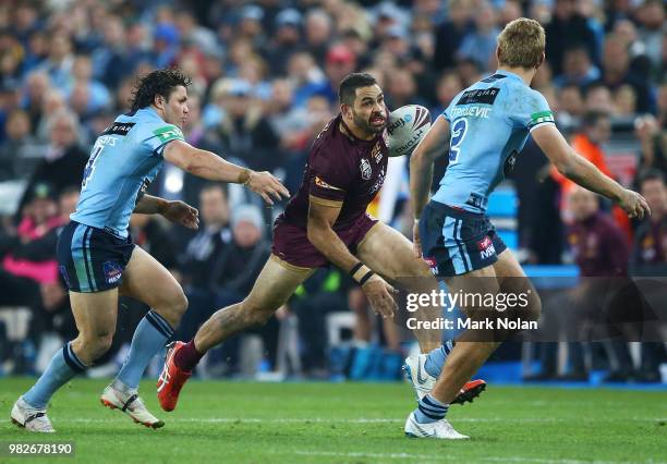 Greg Inglis of the Maroons runs the ball during game two of the State of Origin series between the New South Wales Blues and the Queensland Maroons...