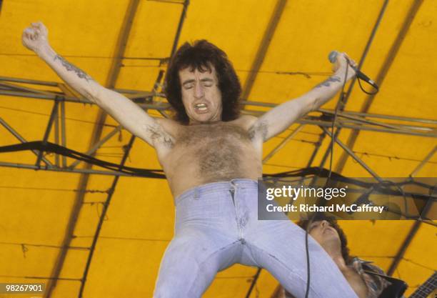 Bon Scott of AC/DC performs live at The Oakland Coliseum in 1978 in Oakland, California.