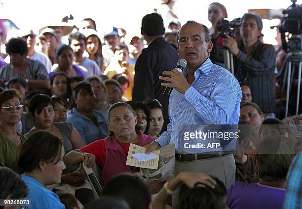 Mexican President Felipe Calderon talks to inhabitants of Mexicali on April 5, 2010 in Baja California state, Mexico, following the 7.2-magnitude...