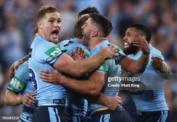 Jack de Belin and James Tedesco of the Blues celebrate a Maroons knock on in the final minute during game two of the State of Origin series between...