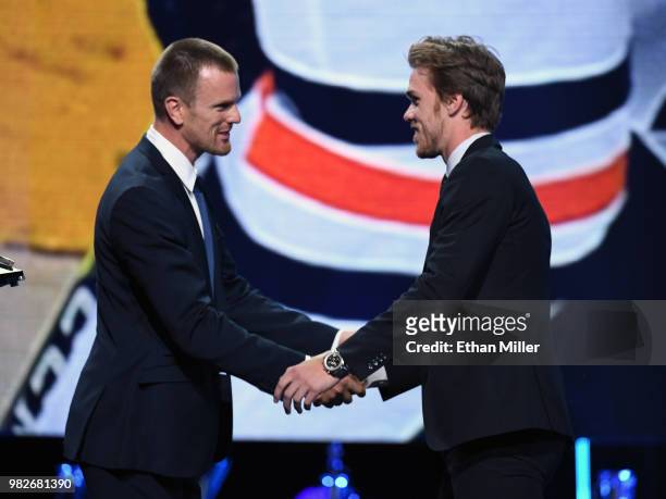 Daniel Sedin of the Vancouver Canucks presents Connor McDavid of the Edmonton Oilers with the Ted Lindsay Award, given to the most outstanding player...