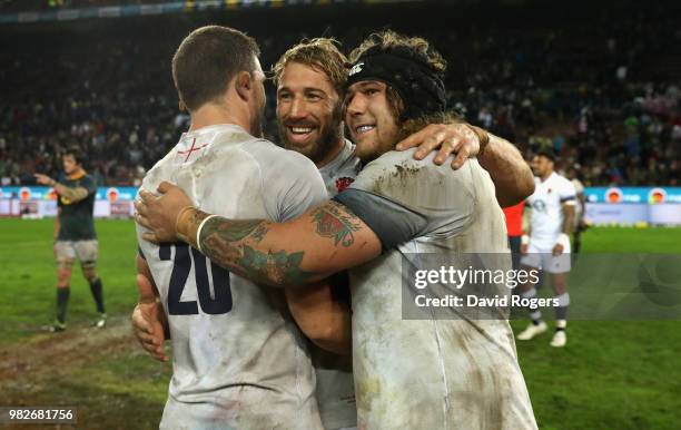 Mark Wilson Chris Robshaw and Harry Williams celebrate their victory during the third test match between South Africa and England at Newlands Stadium...