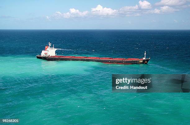 Fuel oil leaks from the Shen Neng 1, a Chinese-registered bulk coal carrier grounded in the Great Barrier Reef Marine Park on April 4 off the coast...