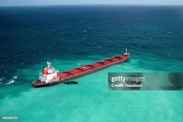Fuel oil leaks from the Shen Neng 1, a Chinese-registered bulk coal carrier grounded in the Great Barrier Reef Marine Park on April 4 off the coast...