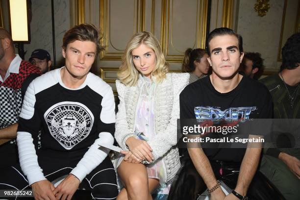 Oliver Cheshire, Xenia Adonts and Carlo Sestini attend the Balmain Menswear Spring/Summer 2019 show as part of Paris Fashion Week on June 24, 2018 in...