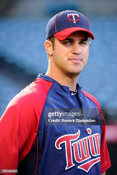 Catcher Joe Mauer of the Minnesota Twins stands on the field during warm ups prior to their Opening Day game against the Los Angeles Angels of...