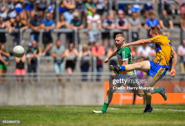 Offaly , Ireland - 24 June 2018; Pearse Lillis of Clare shoots under pressure from Niall Darby of Offaly during the GAA Football All-Ireland Senior...