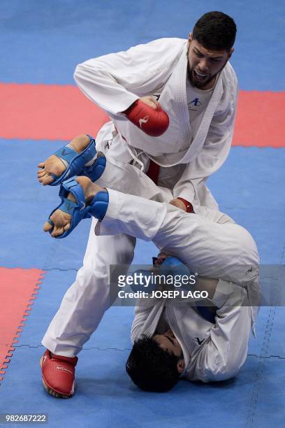 Algeria's Anis samy Brahimi and Turkey's Khaireddine Frigui compete during the Mens Less than 84 Kg Match 120 Karate competition of the XVIII...