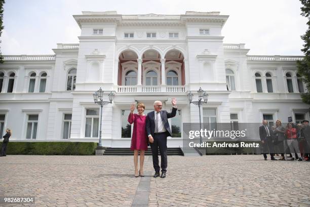 German President Frank-Walter Steinmeier and First Lady Elke Buendenbender wave as they for the open-house day at the Villa Hammerschmidt on June 24,...