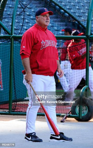 The Los Angeles Angels of Anaheim manager Mike Scioscia stands on the field prior to the game against the Minnesota Twins on Opening Day at Angel...