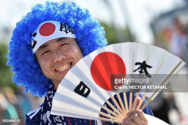 Japan fan poses outside the stadium ahead of the Russia 2018 World Cup Group H football match between Japan and Senegal at the Ekaterinburg Arena in...