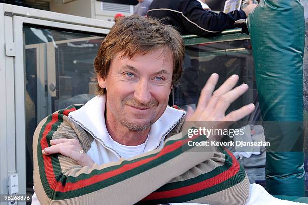 Hall of Famer Wayne Gretzky stands in the dugout of the Minnesota Twins prior to their game against the Los Angeles Angels of Anaheim on Opening Day...