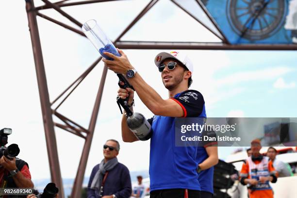 Pierre Gasly of France and Scuderia Toro Rosso shoots t-shirts into the crowd before the Formula One Grand Prix of France at Circuit Paul Ricard on...
