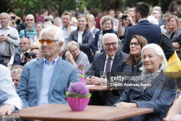 German President Frank-Walter Steinmeier takes a rest and listen to a talk of First Lady Elke Buendenbender and Eckart von Hirschhausen during the...