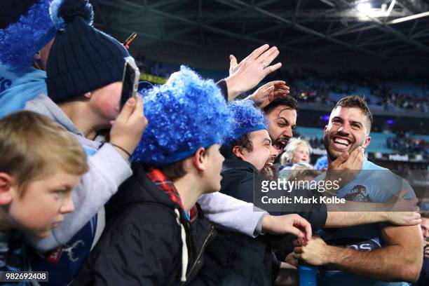 James Tedesco of the Blues celebrates with the crowd after victory in game two of the State of Origin series between the New South Wales Blues and...