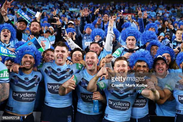 James Tedesco, Angus Crichton, Boyd Cordner Damien Cook and Tyrone Peachey of the Blues celebrate with the crowd after victory in game two of the...