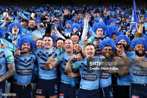 James Tedesco, Angus Crichton, Boyd Cordner Damien Cook and Tyrone Peachey of the Blues celebrate with the crowd after victory in game two of the...