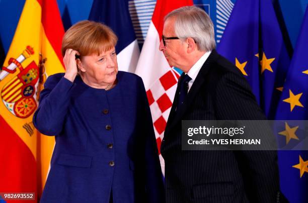 German Chancellor Angela Merkel is welcomed by European Commission President Jean-Claude Juncker for a summit at the EU headquarters in Brussels on...