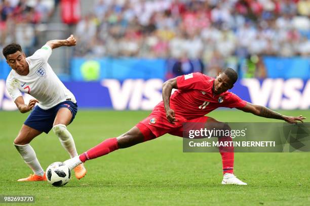 Panama's midfielder Armando Cooper challenges England's midfielder Jesse Lingard during the Russia 2018 World Cup Group G football match between...