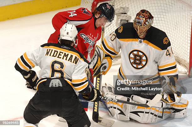 Tuukka Rask of the Boston Bruins makes a save on Tomas Fleischmann of the Washington Capitals shot during a NHL hockey game on April 5, 2010 at the...