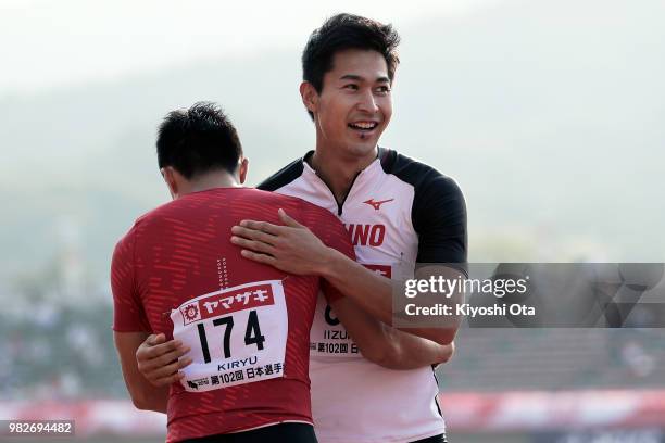 Shota Iizuka celebrates with Yoshihide Kiryu after winning the Men's 200m final on day three of the 102nd JAAF Athletic Championships at Ishin...