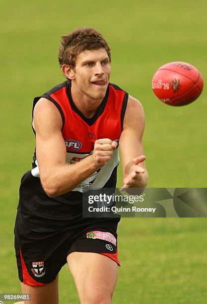 Adam Pattison of the Saints handballs during a St Kilda Saints AFL training session at Linen House Oval on April 6, 2010 in Melbourne, Australia.