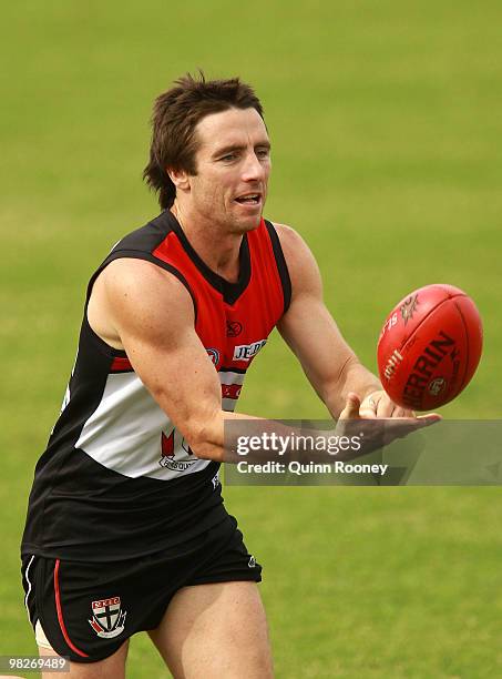 Stephen Milne of the Saints handballs during a St Kilda Saints AFL training session at Linen House Oval on April 6, 2010 in Melbourne, Australia.