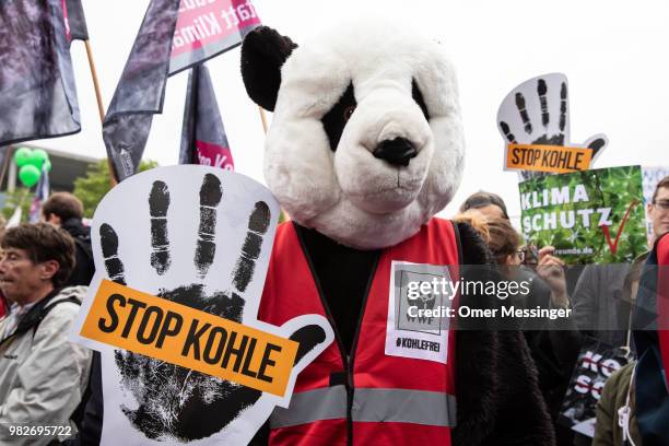 Demonstrators gather in front of the Chancellery during a "Stop Coal" protest on June 24, 2018 in Berlin, Germany. While Germany has set ambitious...