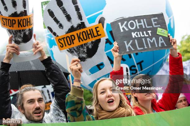 Demonstrators gather in front of the Chancellery during a "Stop Coal" protest on June 24, 2018 in Berlin, Germany. While Germany has set ambitious...