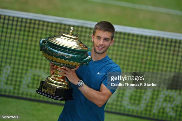Borna Coric of Croatia celebrates after winning the final match against Roger Federer of Switzerland during day seven of the Gerry Weber Open at...
