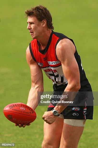 Justin Koschitzke of the Saints handballs during a St Kilda Saints AFL training session at Linen House Oval on April 6, 2010 in Melbourne, Australia.