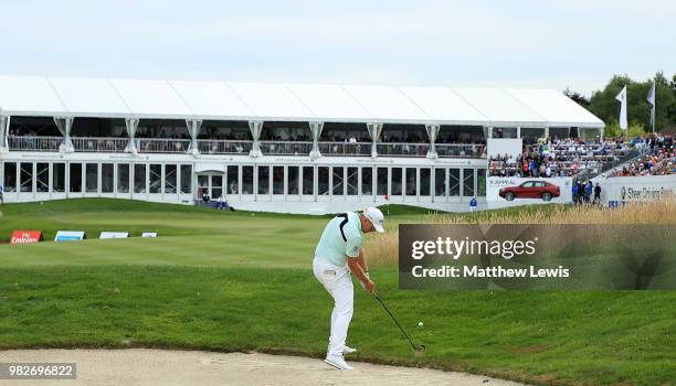 Matt Wallace of England plays his second shot on the 18th hole during the fourth round of the BMW International Open at Golf Club Gut Larchenhof on...