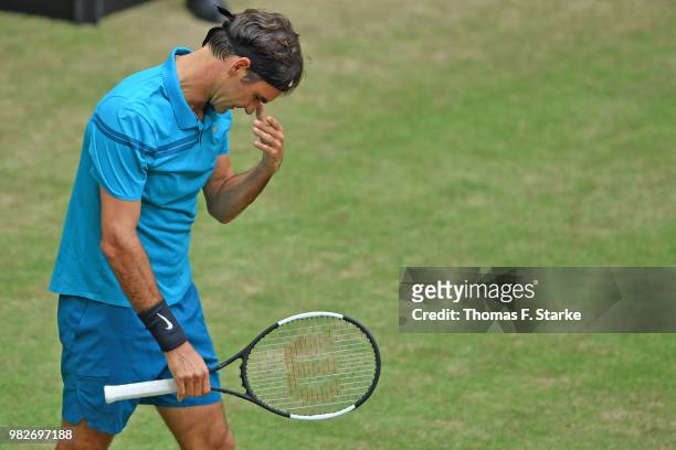 Roger Federer of Switzerland looks dejected in the final match against Borna Coric of Croatia during day seven of the Gerry Weber Open at Gerry Weber...