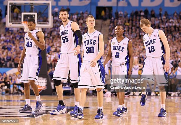 Lance Thomas, Brian Zoubek, Jon Scheyer, Nolan Smith and Kyle Singler of the Duke Blue Devils walk out on the court in the second half while taking...