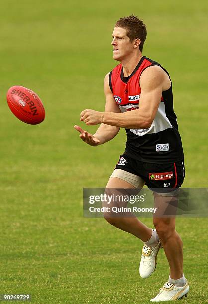 Nick Dal Santo of the Saints handballs during a St Kilda Saints AFL training session at Linen House Oval on April 6, 2010 in Melbourne, Australia.